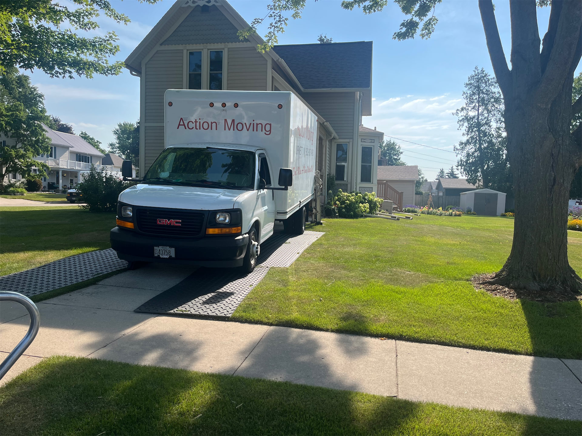 Moving truck near a home by the lake