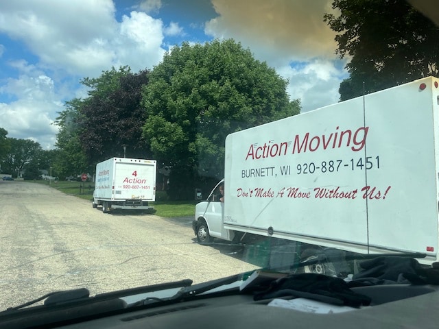 Moving truck backed up to a building