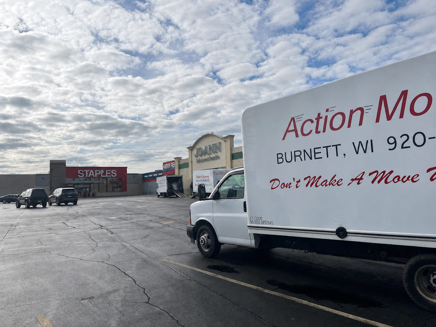 Moving truck backed up to a building for a commercial move