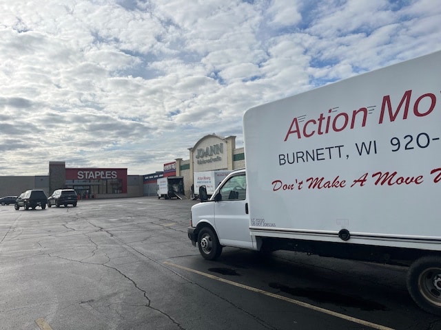 Moving truck backed up to a building for a commercial move