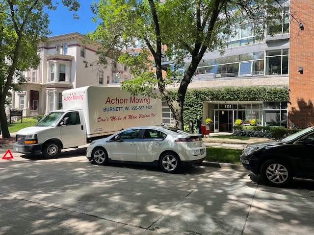 Action Moving truck operating in a city business district