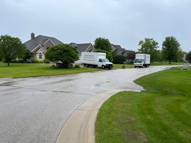 Moving trucks in a suburban neighborhood