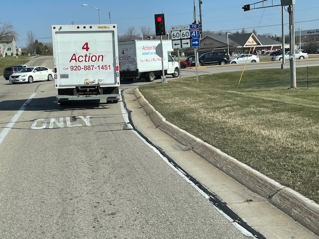 Action Moving trucks traveling together on the road